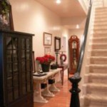 View of foyer and original staircase upon walking through the double front doors! 4050 Adams St