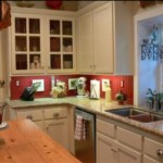 Completely remodeled kitchen with granite countertops, glass-fronted cabinets, gas range top, etc. 4050 Adams St