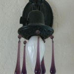 Original sconce lighting and original hardware throughout the home!