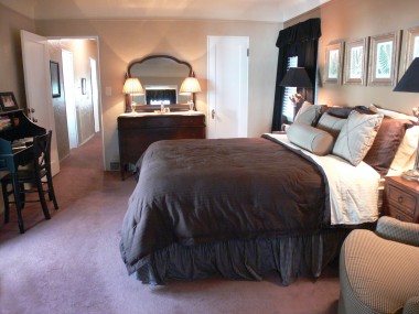 Alternate view of master bedroom suite looking down the hallway with French doors to patio on the left.