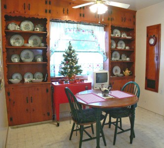 Built-in knotty pine hutches in breakfast nook.
