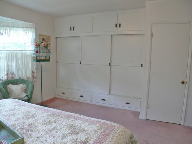 Master bedroom closets (note the cabinets above and the drawers below).  Door to the far right is a cedar-lined walk-in closet.