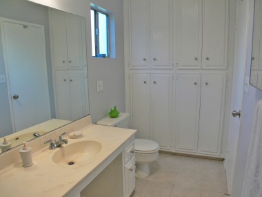 Second bathroom. Note all the linen cabinets and storage in this room. Photographed from inside the large shower stall. 4459 Oakwood Pl., Riverside
