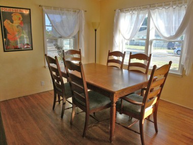 Formal dining room with lots of natural light and built-in cabinetry (maybe remove the sliding doors to display your fine dishware and glassware). 4459 Oakwood Pl., Riverside