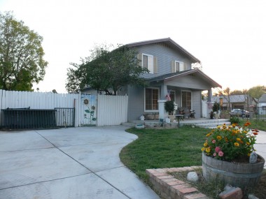 Front yard is secured with decorative wrought iron fence. Notice the large parking area which can fit 5 cars and a 30-foot RV! 4494 Elmwood Ct., Riverside
