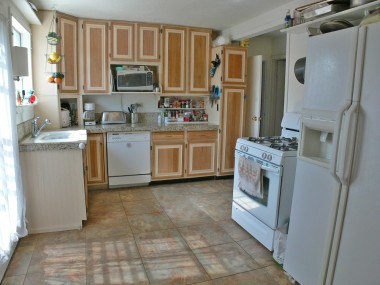 Bright updated kitchen with dishwasher, granite counter tops and tile floor. 4494 Elmwood Ct., Riverside