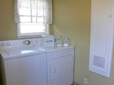 Laundry room with original built-in ironing board. There is plenty of storage in this room as well. 4459 Oakwood Pl., Riverside